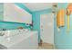 Laundry room with white washer and dryer set and functional storage cabinets at 1271 Nantucket Rd, Venice, FL 34293
