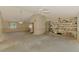 Bright living space with vaulted ceiling, built-in shelving, and open access to other rooms at 1271 Nantucket Rd, Venice, FL 34293