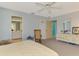 Bedroom featuring carpet flooring, a rocking chair and ensuite bathroom at 1271 Nantucket Rd, Venice, FL 34293