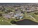 High aerial view of the community showcasing the clubhouse, golf course, and neighborhood at 1311 Tuscany Blvd, Venice, FL 34292