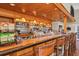 Fully stocked bar showcasing a wide selection of spirits and glassware at 1311 Tuscany Blvd, Venice, FL 34292