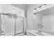 Bright bathroom featuring shower/tub combo with sliding glass door and a white vanity at 1311 Tuscany Blvd, Venice, FL 34292