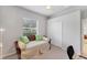 Spare bedroom with a comfortable daybed, closet, mirror, and a fan at 1311 Tuscany Blvd, Venice, FL 34292