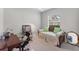 Spare bedroom with a comfortable daybed, desk, mirror, and a fan at 1311 Tuscany Blvd, Venice, FL 34292