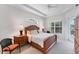 Serene bedroom featuring a ceiling fan and a lovely window bringing in natural light at 1311 Tuscany Blvd, Venice, FL 34292