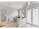 Cozy dining area features tile floors, a large arched window, and french doors at 1311 Tuscany Blvd, Venice, FL 34292