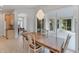 Dining area with stylish pendant lighting and sliding glass doors to outdoor space at 1311 Tuscany Blvd, Venice, FL 34292