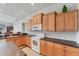 Functional kitchen featuring ample counter space, white appliances, and light wood cabinetry at 1311 Tuscany Blvd, Venice, FL 34292