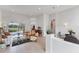 Open concept living room featuring tile floors, recessed lighting, and an archway at 1311 Tuscany Blvd, Venice, FL 34292