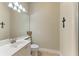 Cozy bathroom with a single sink, toilet, and walk-in shower, all adorned with religious decor at 13167 Fernando St, Venice, FL 34293