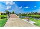 Charming community bridge with a brick walkway, serene water views, and a bench to relax at 13167 Fernando St, Venice, FL 34293