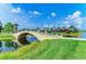 Scenic community bridge over the water with manicured landscaping at 13167 Fernando St, Venice, FL 34293