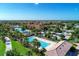 Aerial view of community pools, lounging areas, and surrounding community at 13167 Fernando St, Venice, FL 34293
