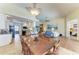 Dining room with wooden table, chandelier, and views of the kitchen and living spaces at 13167 Fernando St, Venice, FL 34293