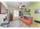 Comfortable living room with built-in shelving, a futon, and sports decor at 13167 Fernando St, Venice, FL 34293