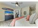 Bright bedroom with a large TV, dresser, and views into other living spaces at 13167 Fernando St, Venice, FL 34293