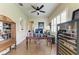 Well-lit office with a ceiling fan, plantation shutters and a wine refrigerator at 13167 Fernando St, Venice, FL 34293