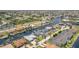 Aerial view of the neighborhood with waterfront homes, canals and lush greenery, highlighting the community at 1424 Mediterranean Dr # 112, Punta Gorda, FL 33950