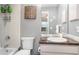 Cozy bathroom featuring tiled shower, a sleek vanity with countertop, and decorative accents at 1424 Mediterranean Dr # 112, Punta Gorda, FL 33950