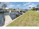 Canal with boat lift and dock, providing direct access to the water for boating and recreation at 1424 Mediterranean Dr # 112, Punta Gorda, FL 33950
