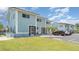 Two-story condo featuring a well-maintained lawn, a private entrance, and convenient parking at 1424 Mediterranean Dr # 112, Punta Gorda, FL 33950
