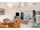 Spacious living and dining area with wicker chairs and a water view at 1424 Mediterranean Dr # 112, Punta Gorda, FL 33950