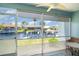 Enclosed porch with a view of boat docks and canal, offering a serene outdoor space at 1424 Mediterranean Dr # 112, Punta Gorda, FL 33950