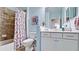 Well-lit bathroom featuring a tub-shower combo and single sink vanity with granite countertops at 1503 Calle Grand St, Bradenton, FL 34209
