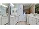 Bright bathroom featuring double sinks with granite countertops and tiled walk-in shower at 1503 Calle Grand St, Bradenton, FL 34209