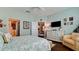 Inviting bedroom with a king bed, hardwood flooring, and neutral decor for a peaceful retreat at 1503 Calle Grand St, Bradenton, FL 34209