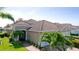 Tile roof and well-maintained landscaping add beauty to the exterior of this lovely tan stucco home at 1503 Calle Grand St, Bradenton, FL 34209