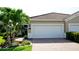This lovely home has an attached garage with a paved driveway and well-maintained landscaping at 1503 Calle Grand St, Bradenton, FL 34209