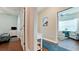 Hallway showcasing hardwood floors, leading to various rooms with seamless flow and natural light at 1503 Calle Grand St, Bradenton, FL 34209