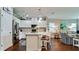Bright, open kitchen with white cabinetry, a granite countertop island, and stainless steel appliances at 1503 Calle Grand St, Bradenton, FL 34209