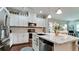 Well-equipped kitchen featuring a granite countertop island, stainless steel appliances, and ample cabinet space at 1503 Calle Grand St, Bradenton, FL 34209