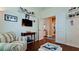 Cozy living space featuring hardwood floors, comfortable seating, and a TV for relaxation at 1503 Calle Grand St, Bradenton, FL 34209