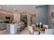 Stylish kitchen with a spacious island, modern appliances, and an adjacent dining area at 15164 Cuzcorro Ct, Nokomis, FL 34275