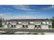 Attractive new townhomes with attached garages and manicured landscaping create excellent curb appeal at 15176 Cuzcorro Ct, Nokomis, FL 34275