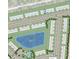 Aerial view showcasing the community layout, including homes, a lake, and amenities at 15180 Cuzcorro Ct, Nokomis, FL 34275