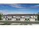Charming townhome exteriors with a light blue and white palette and convenient attached garages at 15180 Cuzcorro Ct, Nokomis, FL 34275