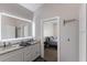 Modern bathroom features double sinks, granite countertops, and great lighting with easy bedroom access at 1606 22Nd W Ave, Palmetto, FL 34221
