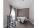 Neutral dining area features a round table with four chairs and a comfy rocking chair for relaxing at 1606 22Nd W Ave, Palmetto, FL 34221