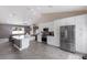 Modern kitchen with stainless steel appliances, sleek cabinetry, and seamless flow into the living area at 1606 22Nd W Ave, Palmetto, FL 34221
