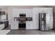 Well-equipped kitchen featuring stainless steel appliances, ample counter space, and modern cabinetry at 1606 22Nd W Ave, Palmetto, FL 34221
