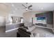 Open-concept living area featuring modern furnishings, a sleek entertainment center, and hardwood floors at 1606 22Nd W Ave, Palmetto, FL 34221