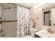 Well-lit bathroom featuring a shower with white subway tile and decorative accents at 1624 Stickney Point Rd # 204, Sarasota, FL 34231