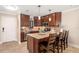Open kitchen boasts granite counters, stainless appliances, and dark-stained wood cabinets at 1624 Stickney Point Rd # 204, Sarasota, FL 34231