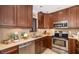 Stylish kitchen with stainless steel appliances, tile backsplash and granite countertops at 1624 Stickney Point Rd # 204, Sarasota, FL 34231