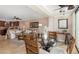 Open-concept living room with comfortable seating, a dining area, and a view of the outdoors at 1624 Stickney Point Rd # 204, Sarasota, FL 34231
