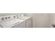 Well-equipped laundry area with a Whirlpool washer and dryer for convenient laundry tasks at 17119 Barnwood Pl, Bradenton, FL 34211
